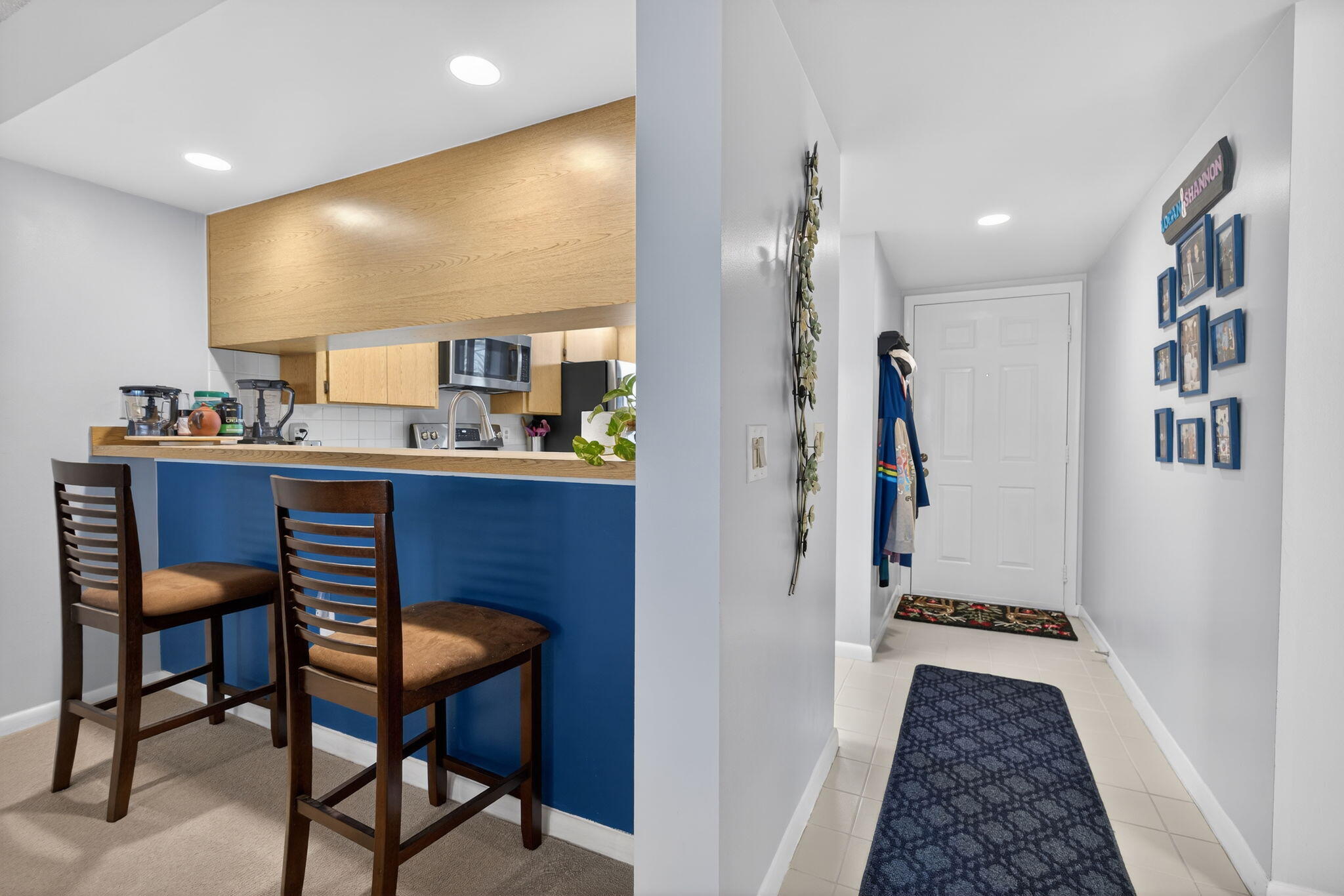 2441 Village Boulevard, Unit 405 West Palm Beach, FL 33409 - Photo 6 of 24 a workspace with furniture and a wooden floor