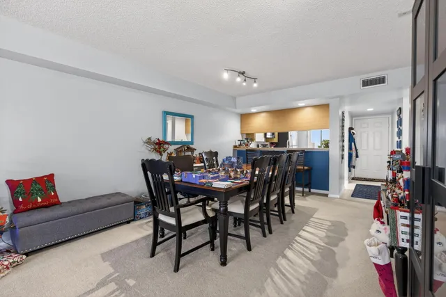 a view of a dining room with furniture and a livingroom