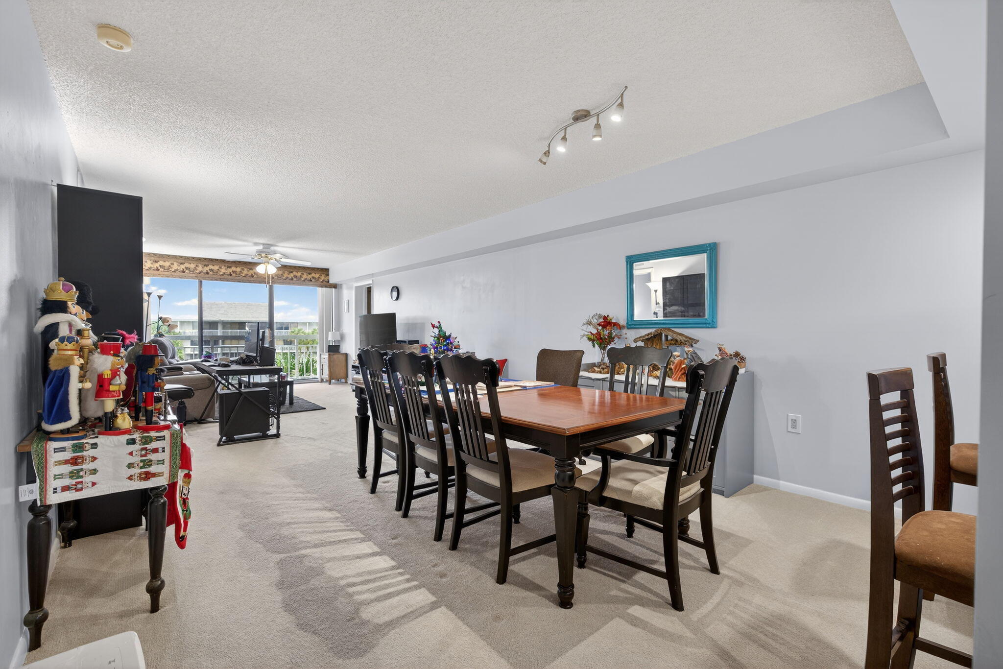 2441 Village Boulevard, Unit 405 West Palm Beach, FL 33409 - Photo 8 of 24 a view of a dining room with furniture and a livingroom