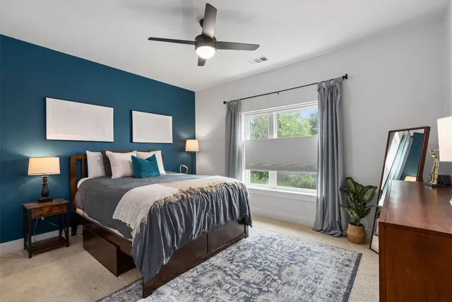 a bed room with a bed and a television