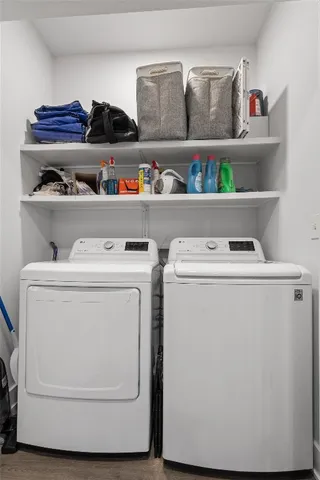 a utility room with washer and dryer