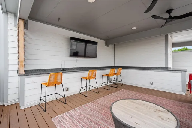 a room with wooden floor and furniture