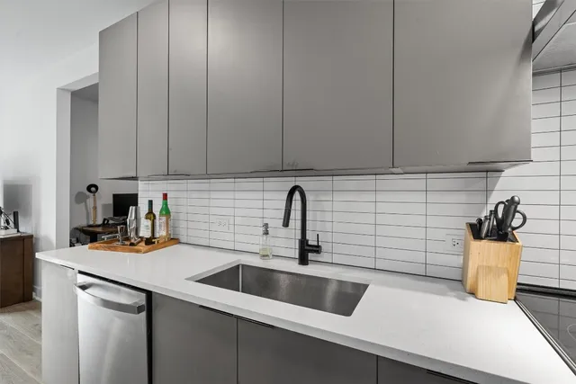 a kitchen with a sink and a stove