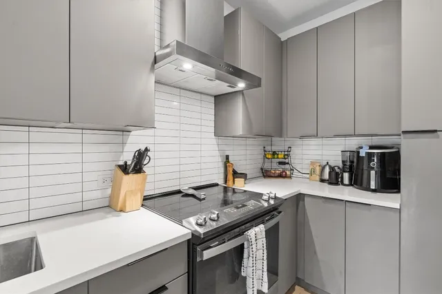 a kitchen with a stove and a sink