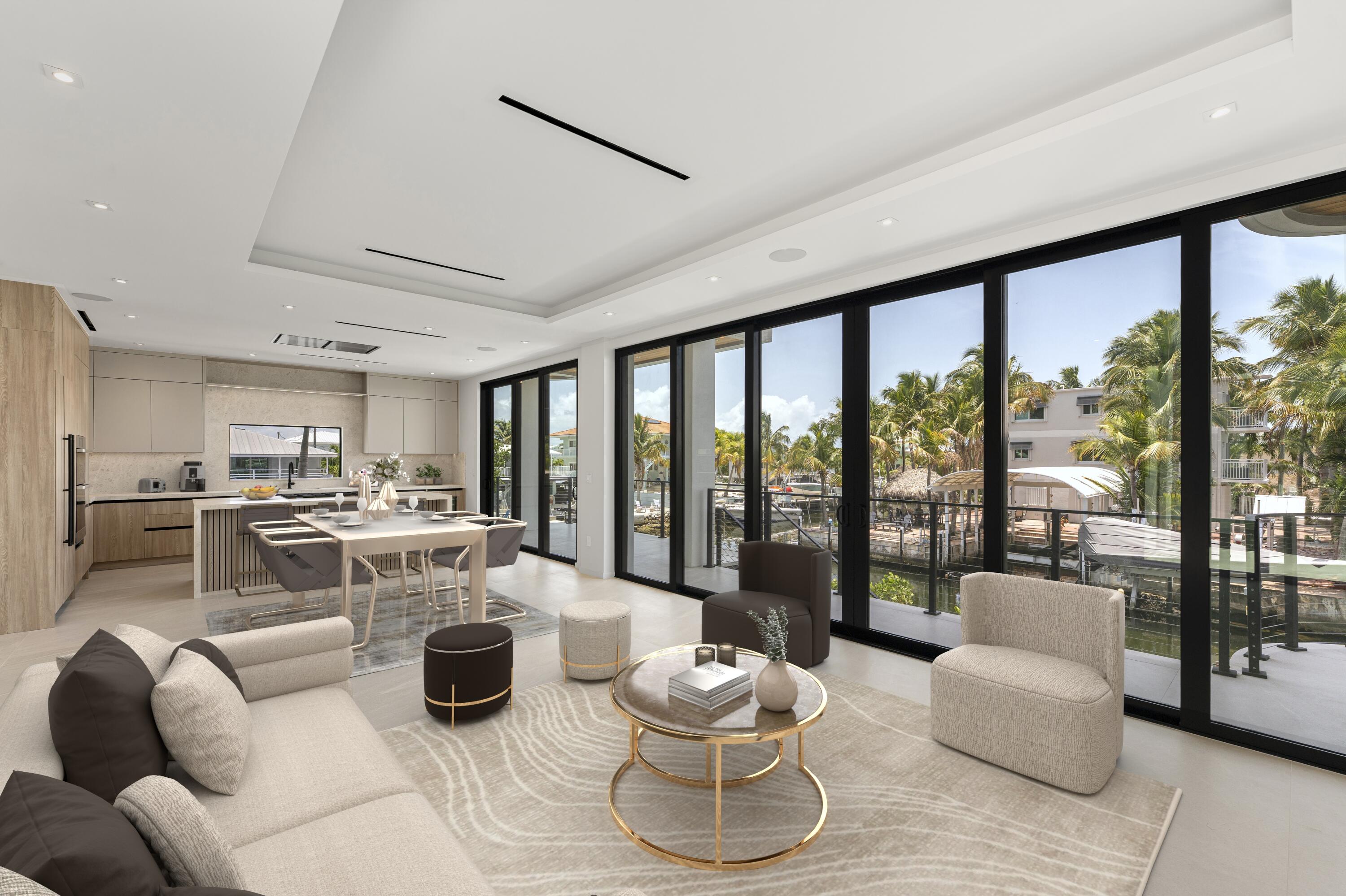 301 Buttonwood Circle, Unit B Key Largo, FL 33037 - Photo 11 of 40 a living room with furniture and a large window