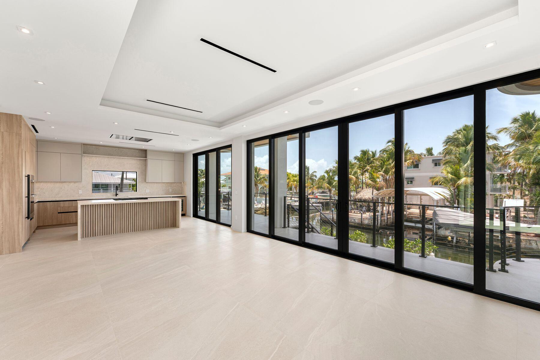 301 Buttonwood Circle, Unit B Key Largo, FL 33037 - Photo 12 of 40 a view of a kitchen with large windows