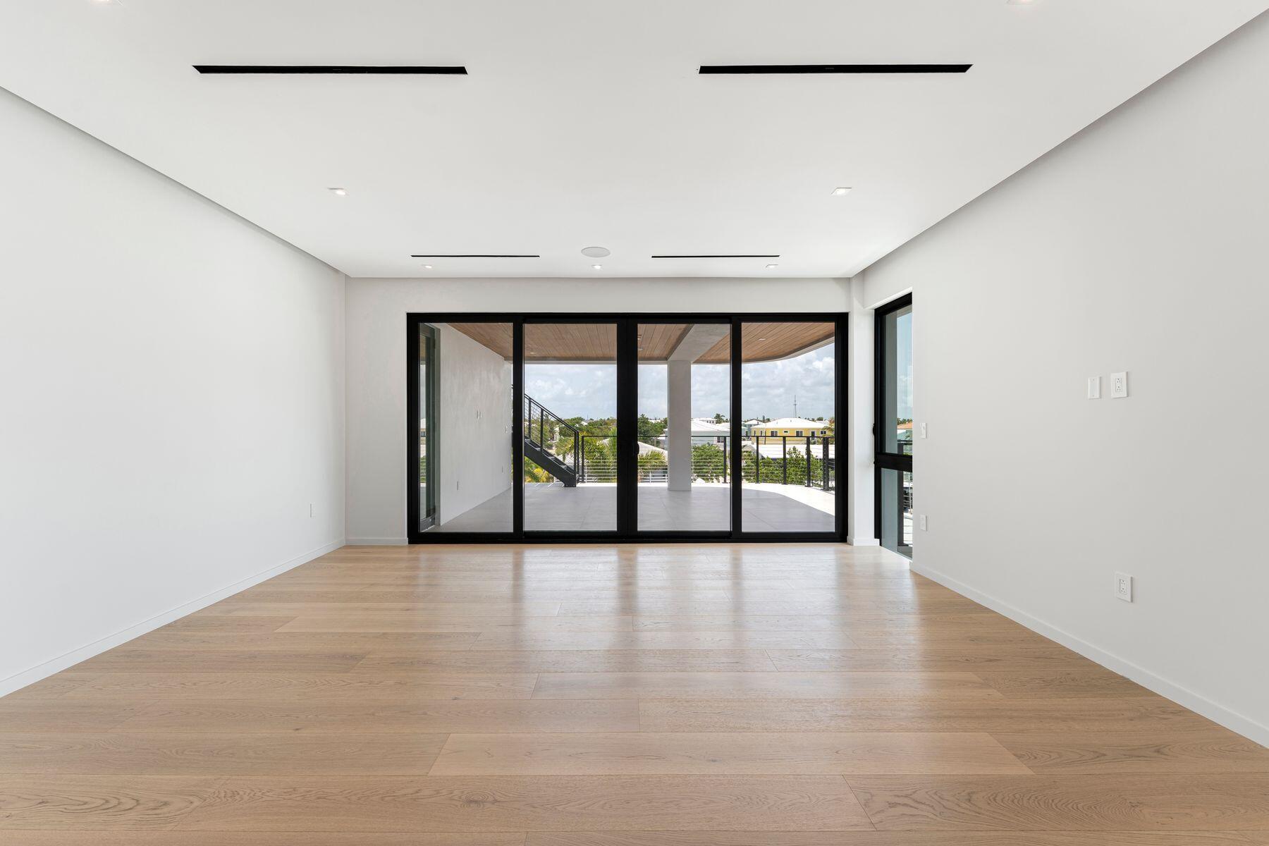 301 Buttonwood Circle, Unit B Key Largo, FL 33037 - Photo 20 of 40 a view of an empty room with a window