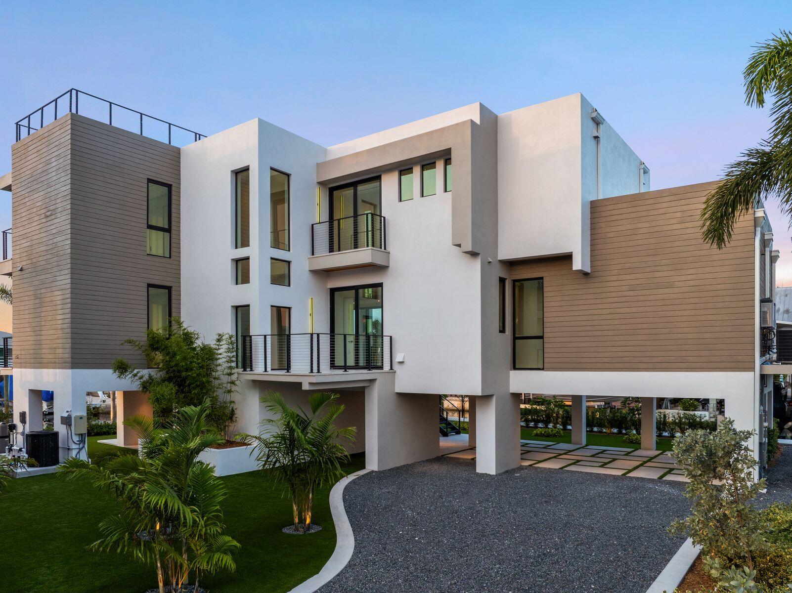 301 Buttonwood Circle, Unit B Key Largo, FL 33037 - Photo 32 of 40 a view of a house with a yard