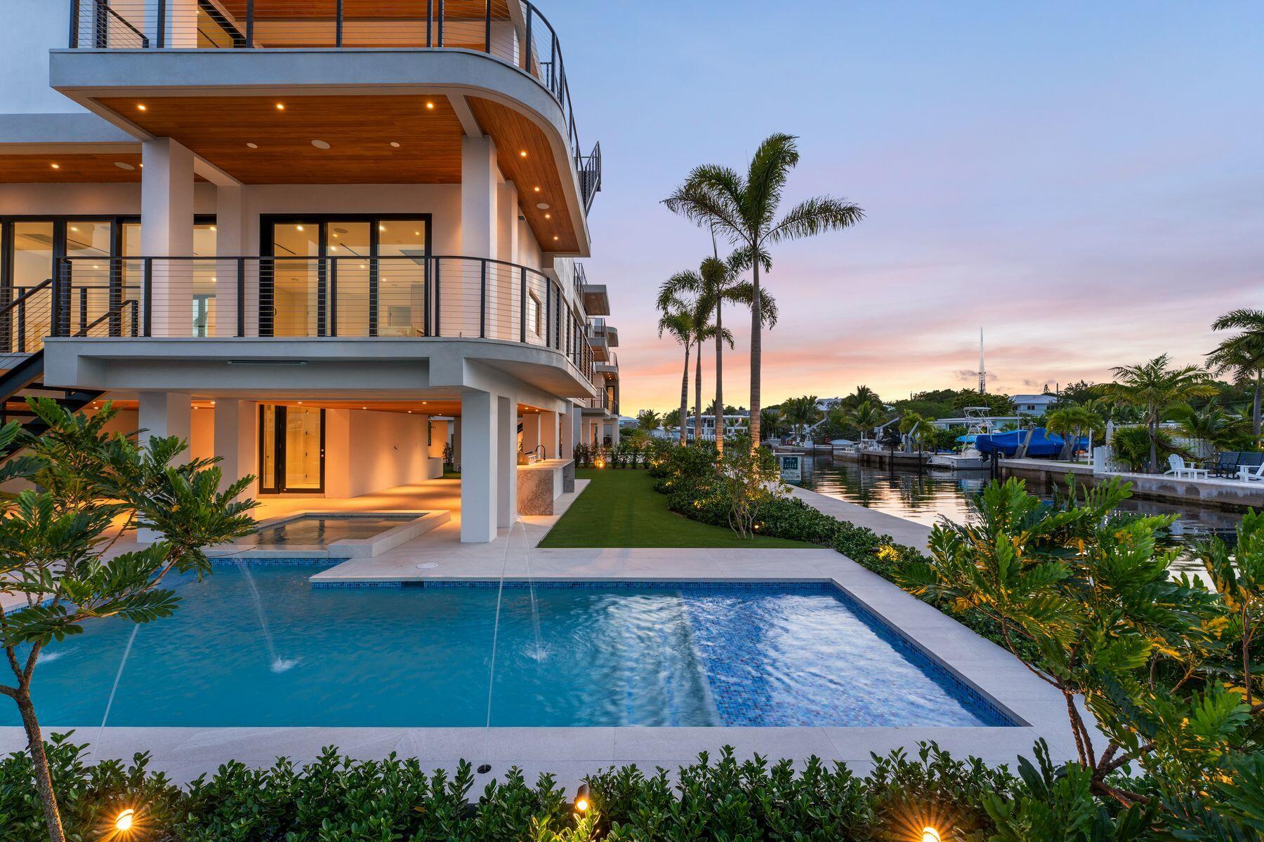 301 Buttonwood Circle, Unit B Key Largo, FL 33037 - Photo 34 of 40 a view of a house with a yard