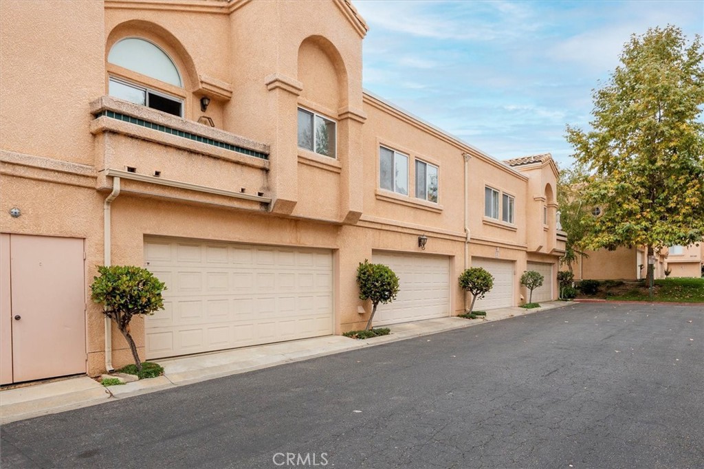 25126 Steinbeck Avenue, Unit D Stevenson Ranch, CA 91381 - Photo 14 of 22 a view of a street with house