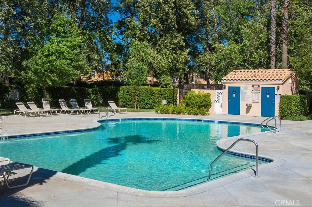 25126 Steinbeck Avenue, Unit D Stevenson Ranch, CA 91381 - Photo 17 of 22 a view of house that has a park