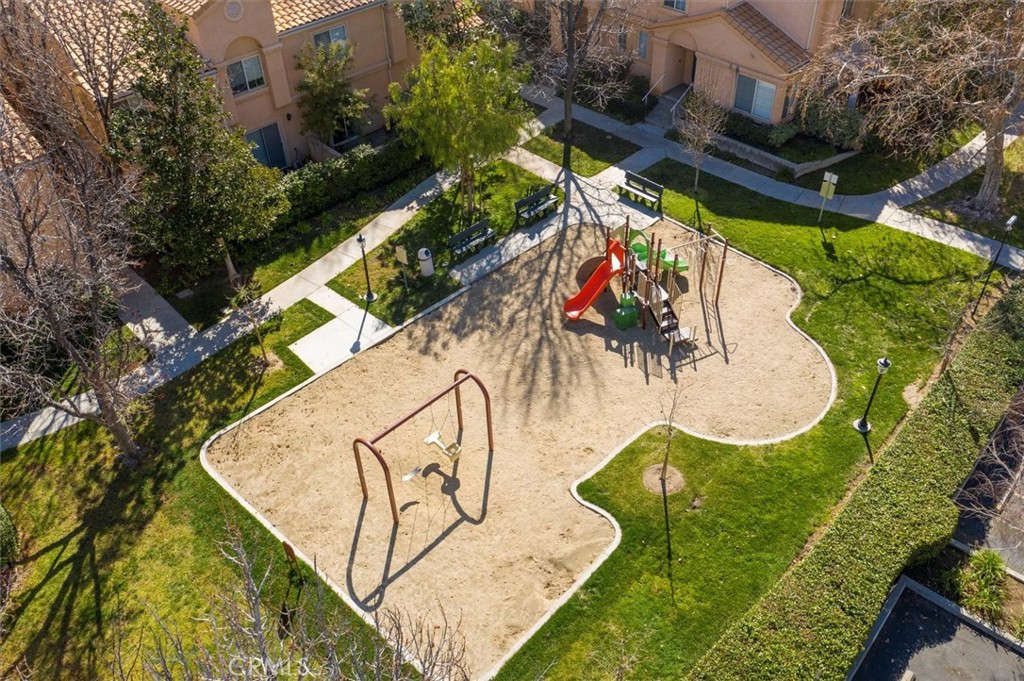 25126 Steinbeck Avenue, Unit D Stevenson Ranch, CA 91381 - Photo 20 of 22 an aerial view of a house with swimming pool