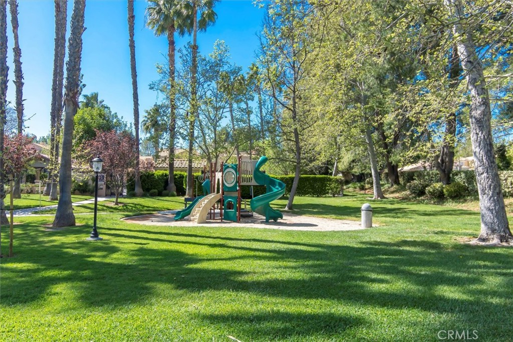 25126 Steinbeck Avenue, Unit D Stevenson Ranch, CA 91381 - Photo 21 of 22 a view of a park and trees