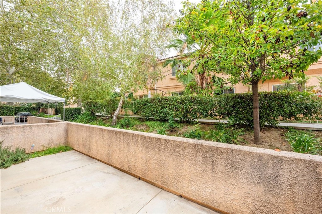 25126 Steinbeck Avenue, Unit D Stevenson Ranch, CA 91381 - Photo 7 of 22 a view of house with yard and green space