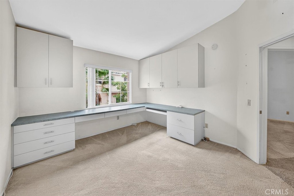 25126 Steinbeck Avenue, Unit D Stevenson Ranch, CA 91381 - Photo 9 of 22 a room with window and cabinet