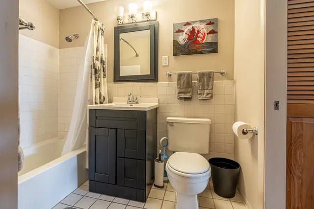 a bathroom with a toilet a sink and bathtub