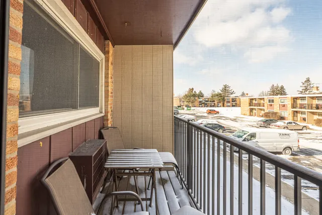 a view of a balcony with furniture