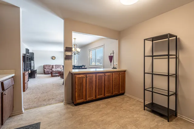 a view of kitchen with sink and furniture