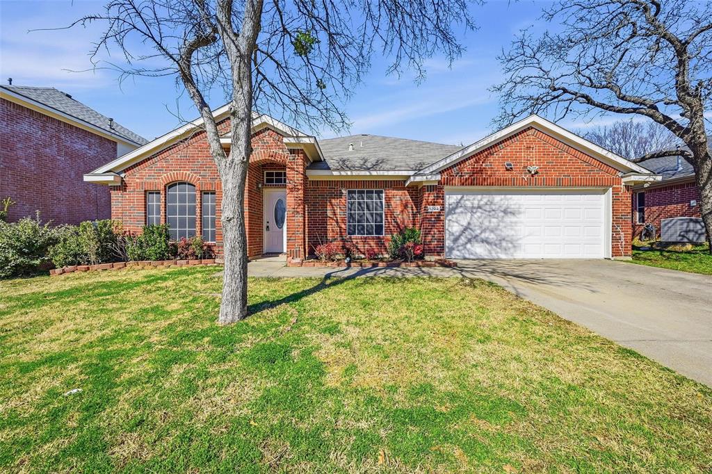 1703 Caladium Drive Corinth, TX 76210 - Photo 1 of 24 a view of a house with a small yard and a large tree