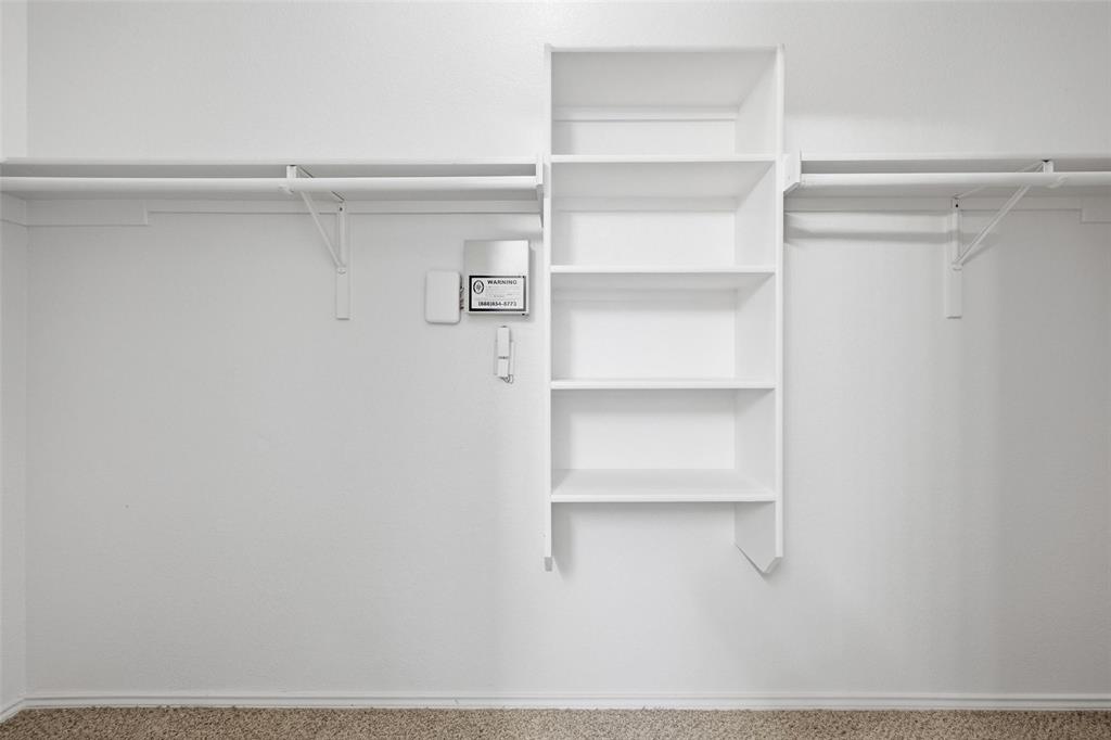 1703 Caladium Drive Corinth, TX 76210 - Photo 14 of 24 a view of an empty walk in closet