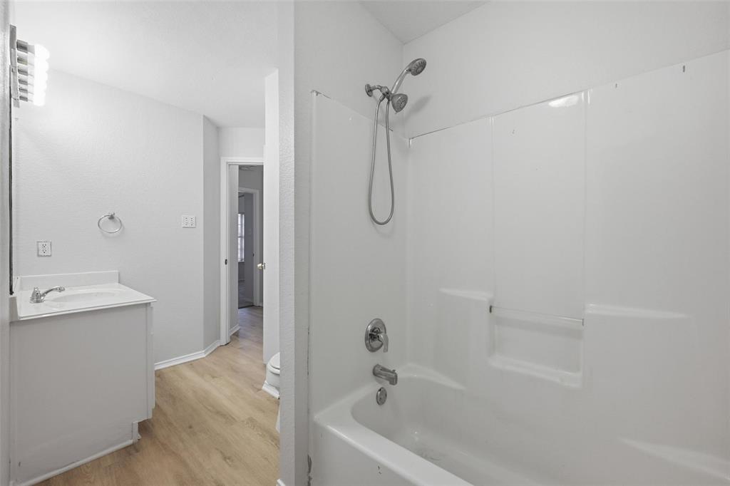 1703 Caladium Drive Corinth, TX 76210 - Photo 20 of 24 a bathroom with a bathtub and shower