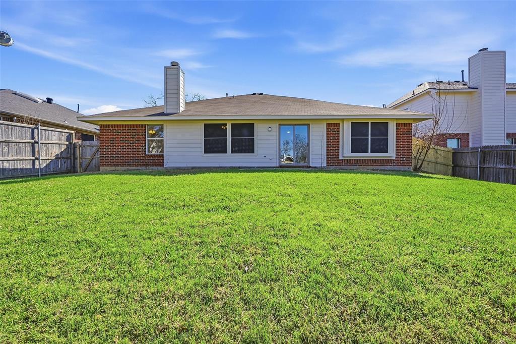 1703 Caladium Drive Corinth, TX 76210 - Photo 24 of 24 a front view of a house with a yard