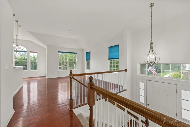 a view of an entryway and wooden floor