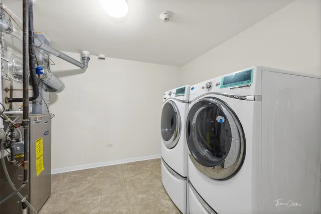 a front view of a house with yard and green space
