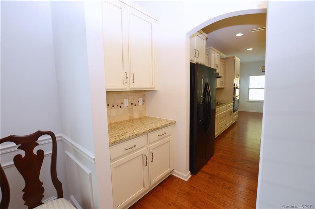 1898 Larkspur Way Tega Cay, SC 29708 - Photo 10 of 35 a kitchen with a refrigerator and a stove