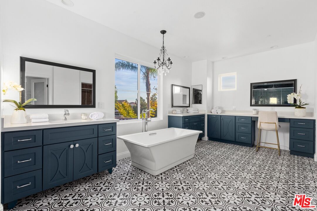 2 Arborwood Irvine, CA 92620 - Photo 12 of 26 a spacious bathroom with a double vanity sink mirror and bathtub