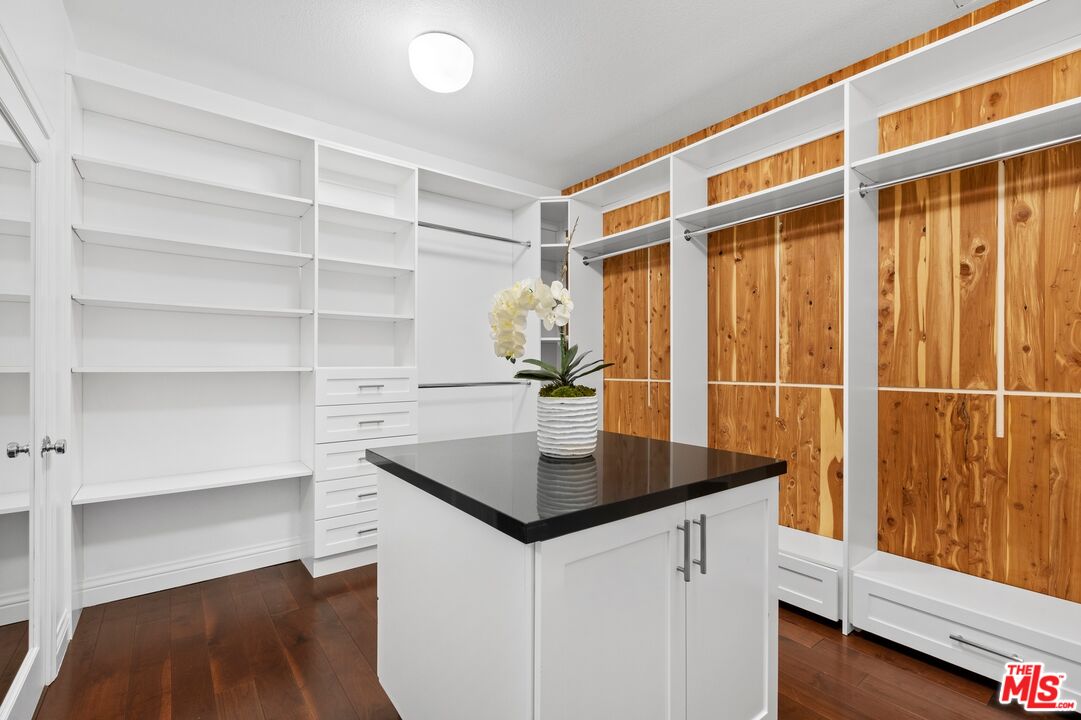2 Arborwood Irvine, CA 92620 - Photo 13 of 26 a kitchen with kitchen island a sink and wooden floor