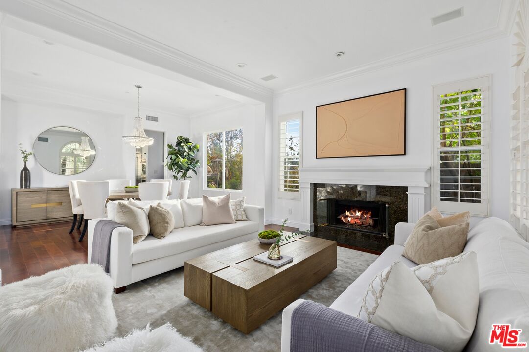 2 Arborwood Irvine, CA 92620 - Photo 4 of 26 a living room with furniture a large window and a fireplace
