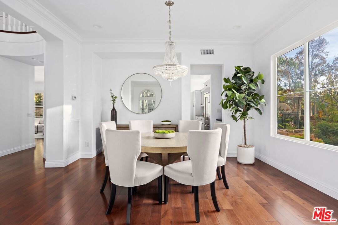 2 Arborwood Irvine, CA 92620 - Photo 5 of 26 a view of a dining room with furniture window and wooden floor