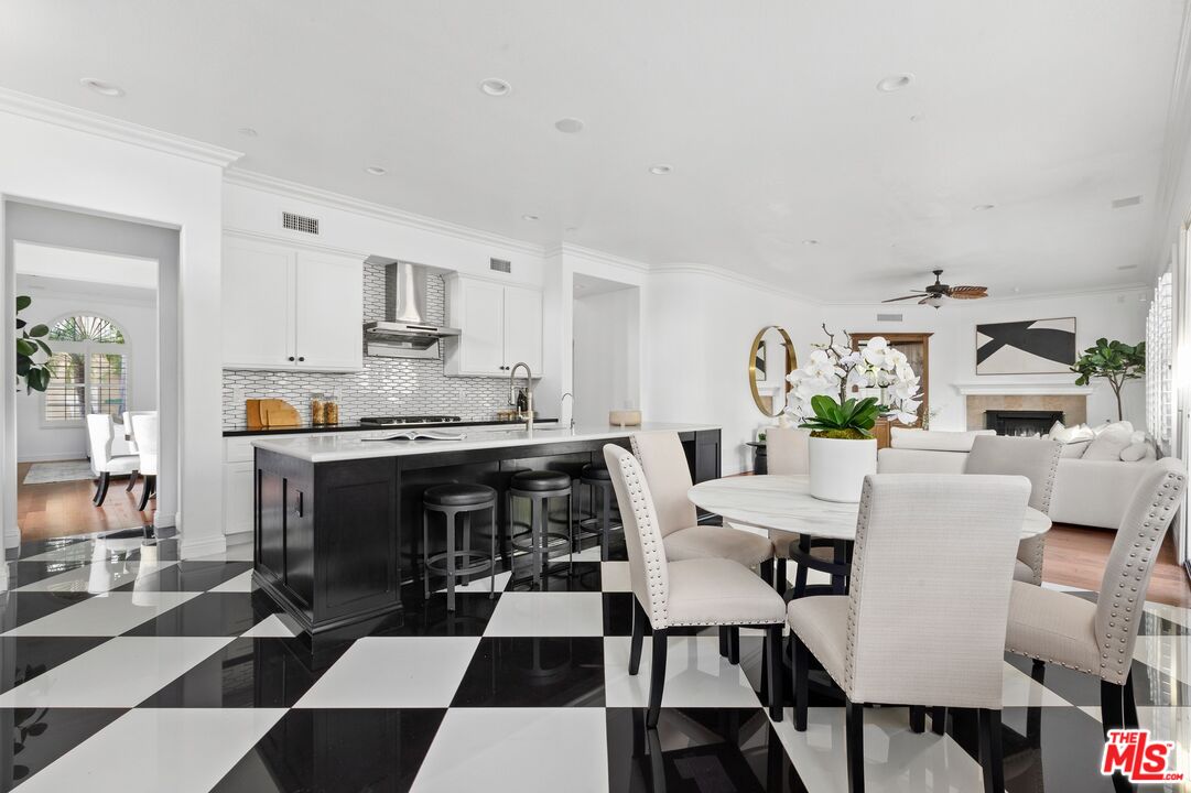 2 Arborwood Irvine, CA 92620 - Photo 6 of 26 a living room with furniture and a dining table with kitchen view