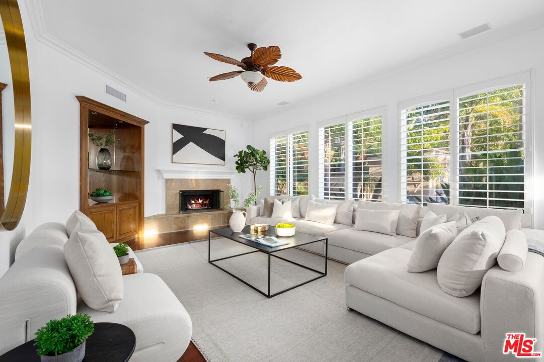 2 Arborwood Irvine, CA 92620 - Photo 9 of 26 a living room with furniture or fireplace and a large window