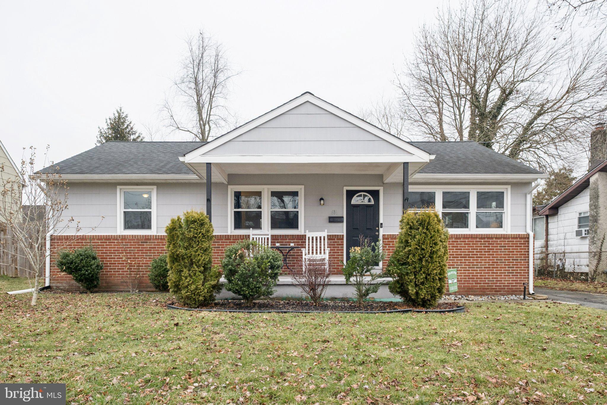 614 Brooke Avenue Magnolia, NJ 08049 - Photo 1 of 33 a front view of house with yard and glass windows
