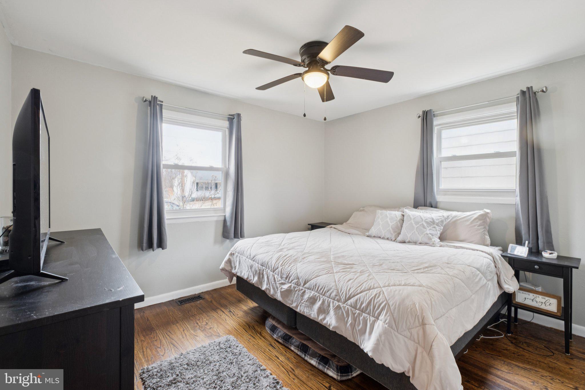 614 Brooke Avenue Magnolia, NJ 08049 - Photo 16 of 33 a bedroom with a bed window and a flat screen tv