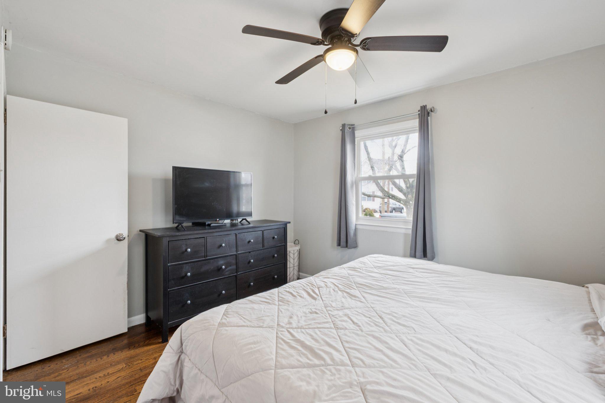614 Brooke Avenue Magnolia, NJ 08049 - Photo 19 of 33 a bedroom with a bed and a flat screen tv