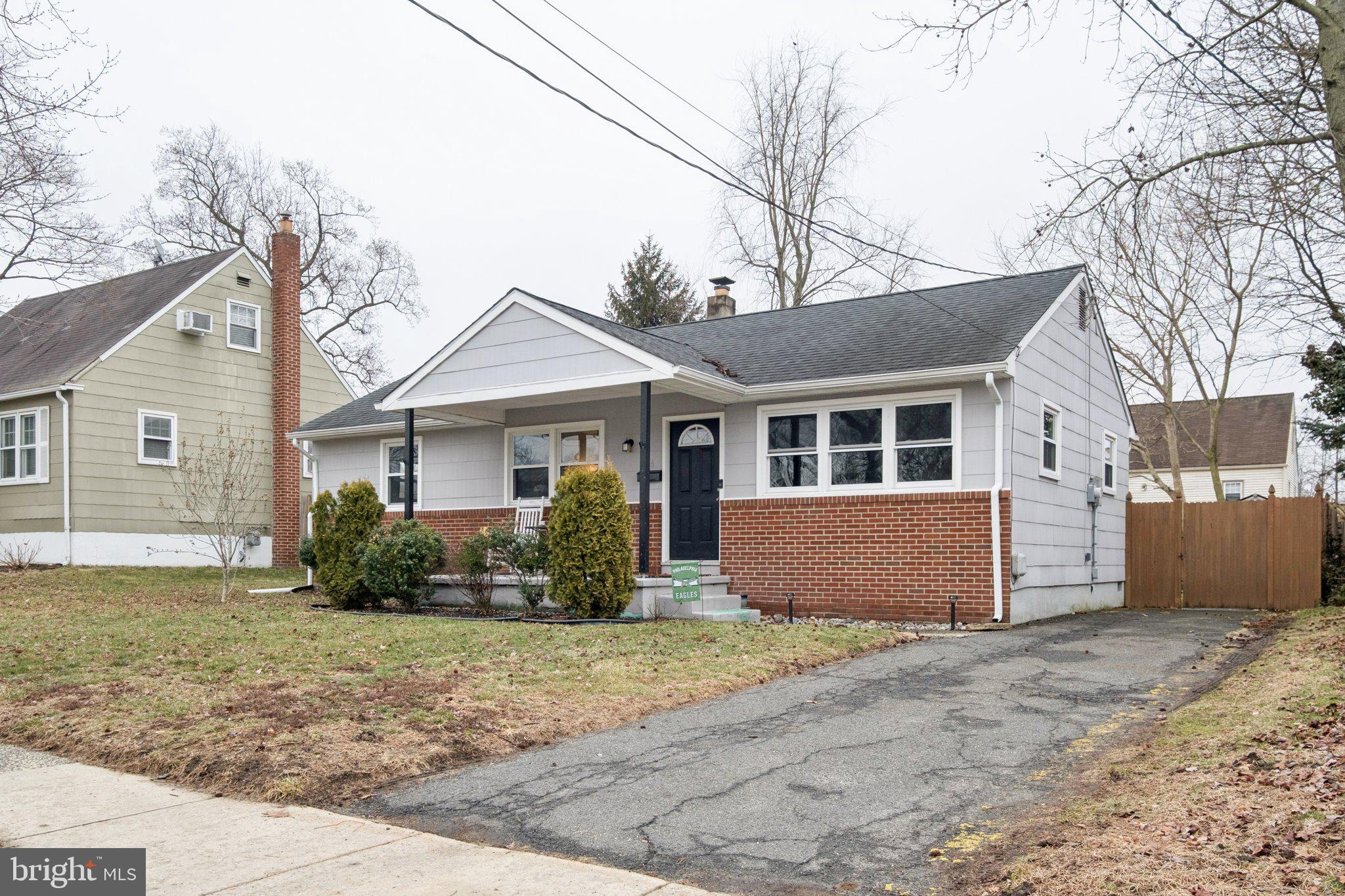 614 Brooke Avenue Magnolia, NJ 08049 - Photo 4 of 33 a front view of a house with a yard