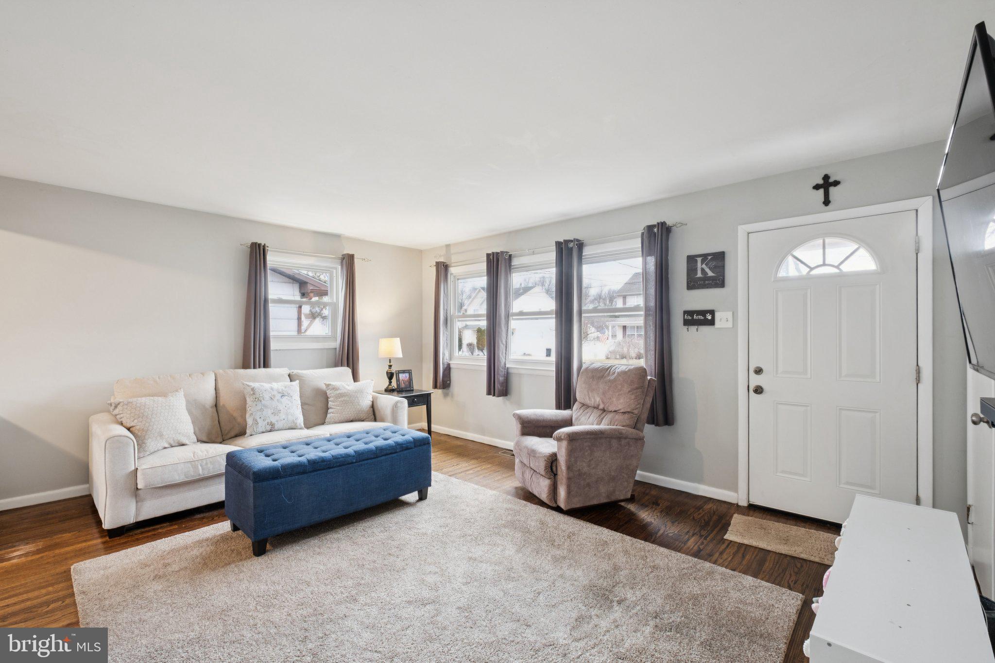 614 Brooke Avenue Magnolia, NJ 08049 - Photo 5 of 33 a living room with furniture and large windows