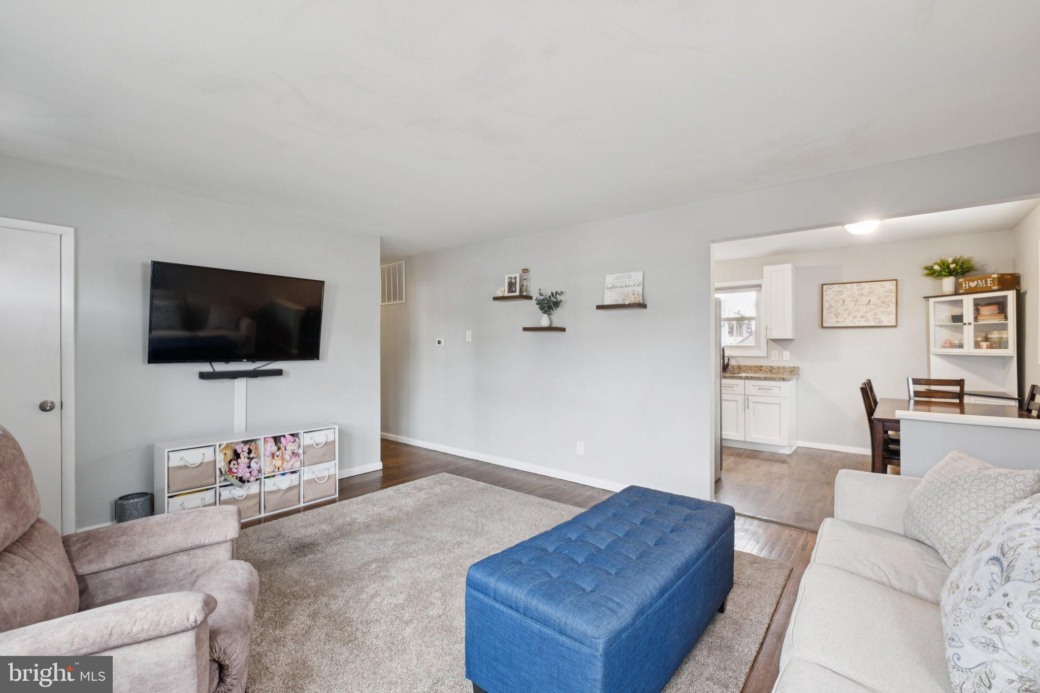 614 Brooke Avenue Magnolia, NJ 08049 - Photo 7 of 33 a living room with furniture and a flat screen tv
