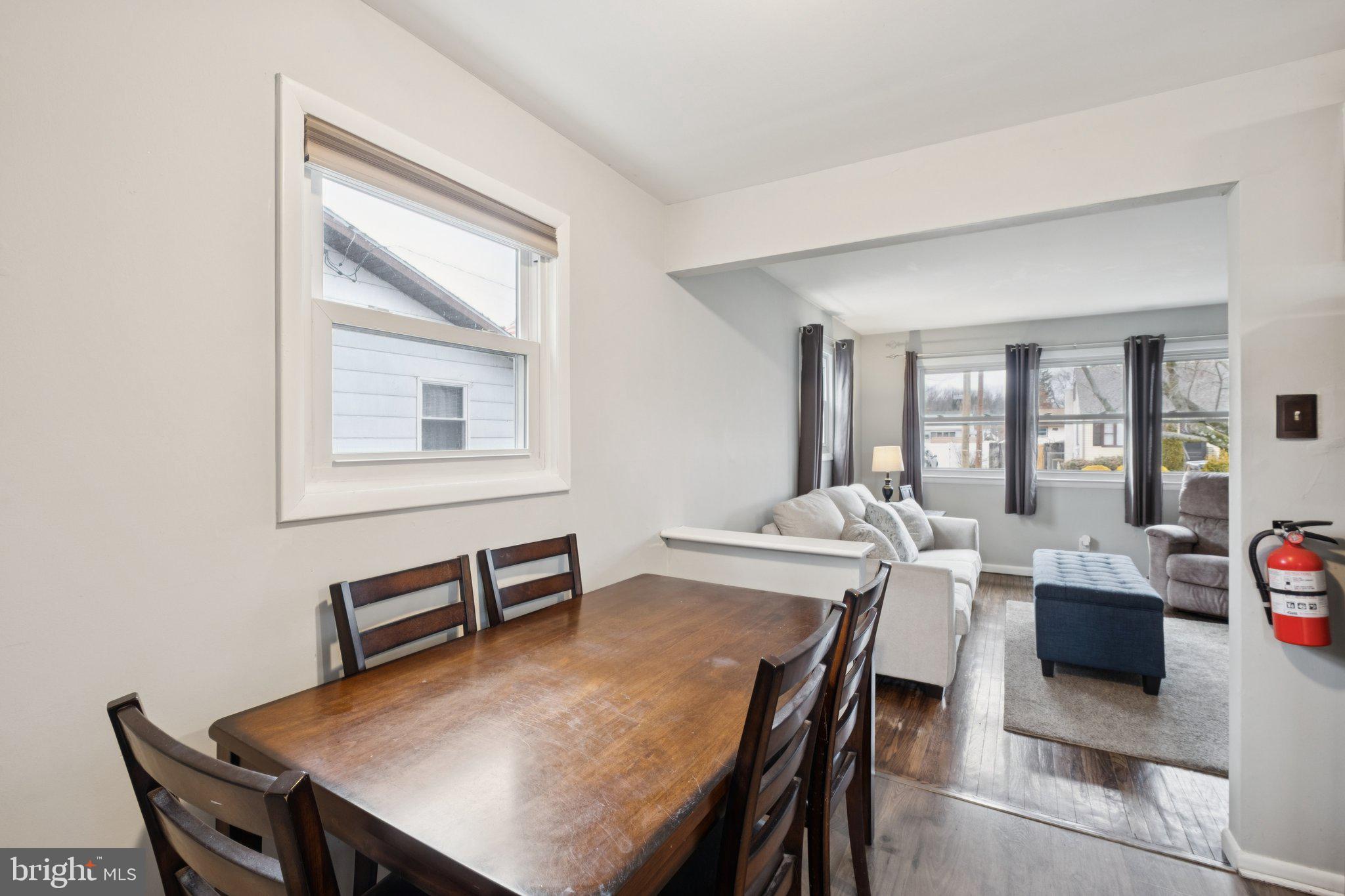 614 Brooke Avenue Magnolia, NJ 08049 - Photo 9 of 33 a view of a dining room with furniture and wooden floor