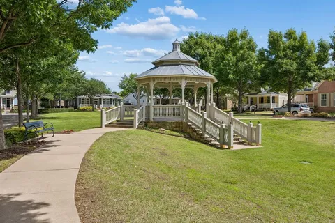 a view of a house with a yard patio and sitting area