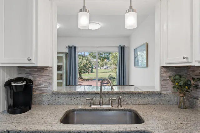 a kitchen with a sink and a window