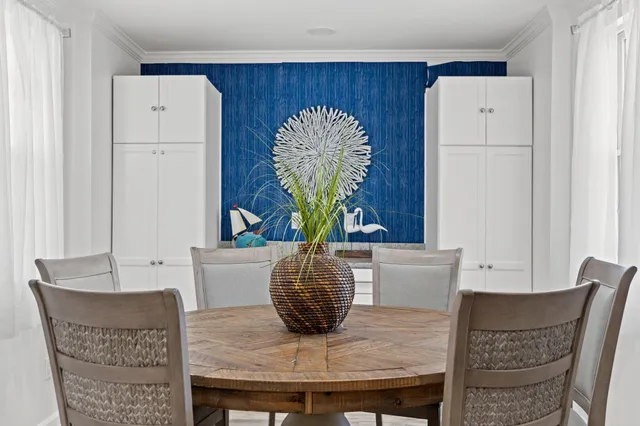 a dining room with furniture and wooden floor