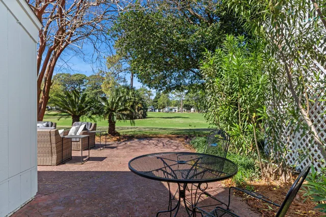 a view of a patio with table and chairs and a fire pit