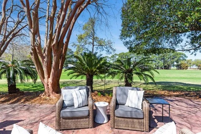 a view of a patio with a table and chairs