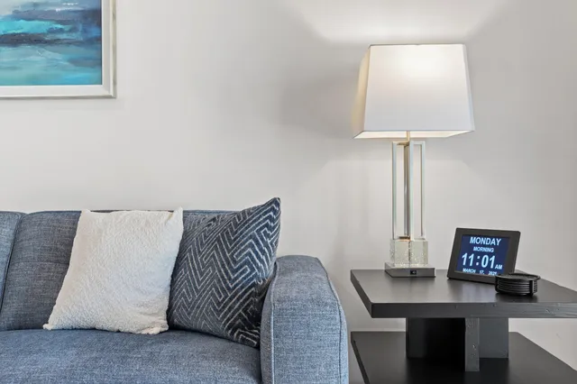 a workspace with furniture and a lamp
