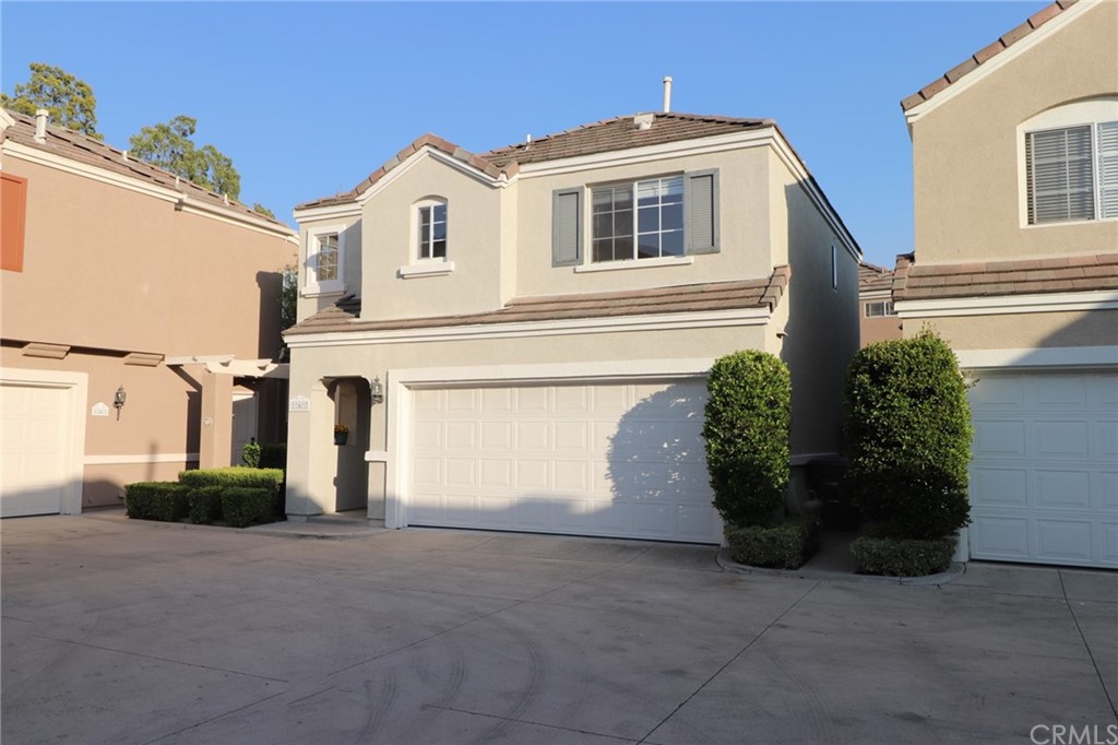 Front of the detached single family home showing the attached 2 car garage.