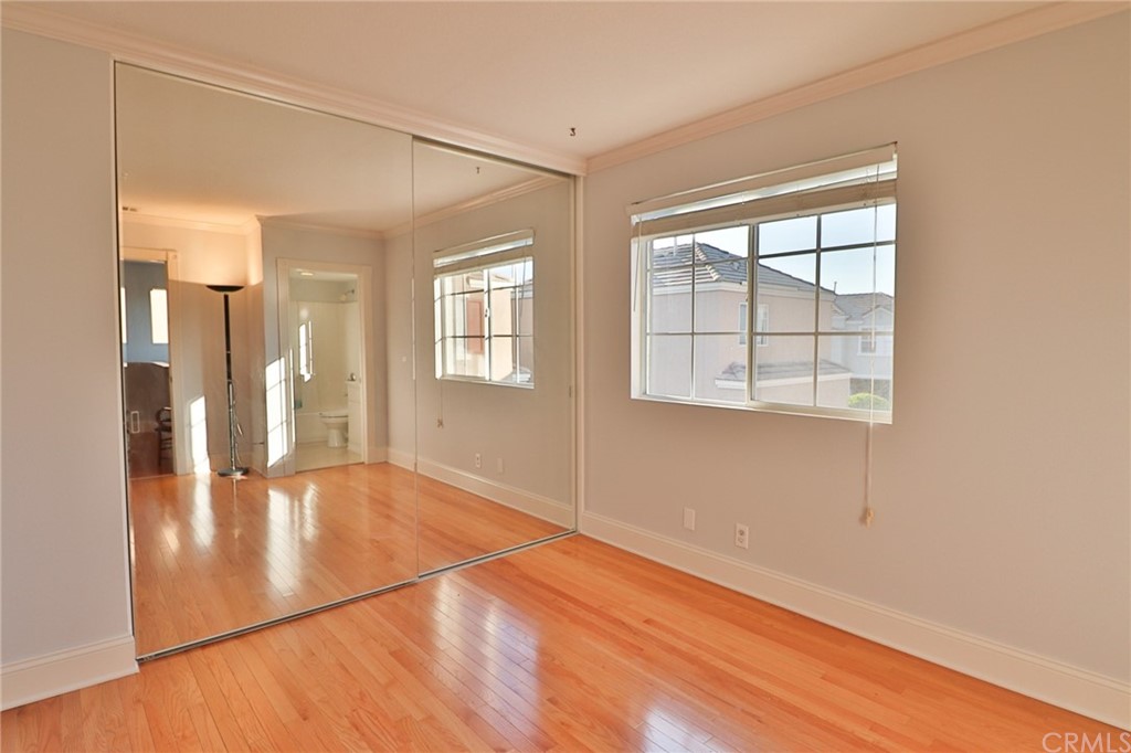6 Rue Monet Lake Forest, CA 92610 - Photo 19 of 24 The secondary bedroom with mirrored wardrobe doors.